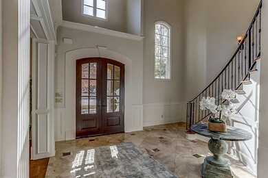 Grand 2 Story Entry with marble floor, circular st