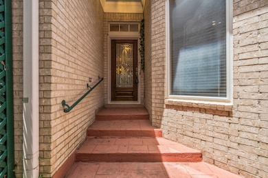 This is a covered entryway featuring terracotta-co