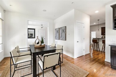 Dining space with recessed lighting, light wood fi