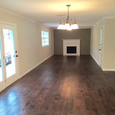 View of Den and Fireplace from Open Kitchen - Dini