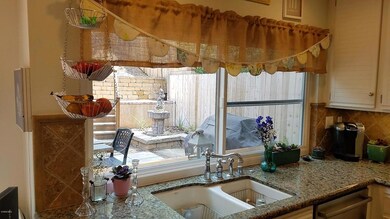 Kitchen w view out pass thru window to B