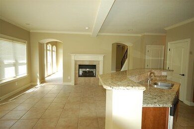 The kitchen has a large island with an attached breakfast bar.