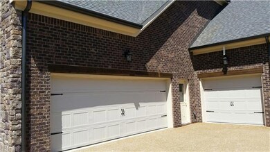 3 car garage with wider 18' garage door for easier turn radius and two entries into home from single garage door side.