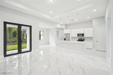 Kitchen with modern cabinets, a raised ceiling, ap