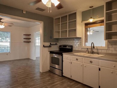 Kitchen with open shelves, stainless steel electr