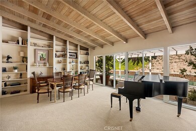 Built-in amazing wall of shelves in dining area.