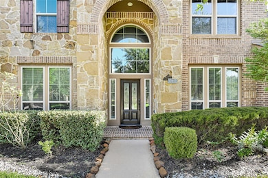 A soaring arched entryway welcomes you with grace—