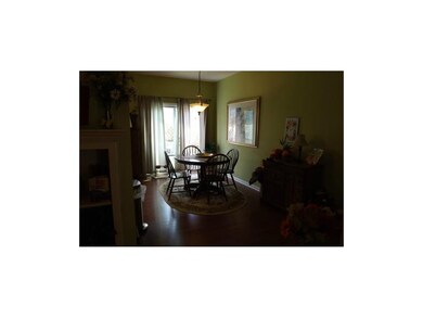 Looking into the dining area & sliding door to bac