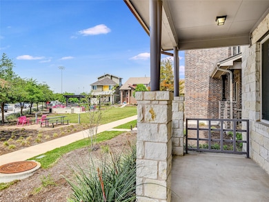 Porch featuring a lawn