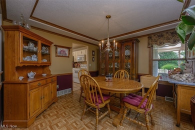 Formal dining room with trayed ceiling