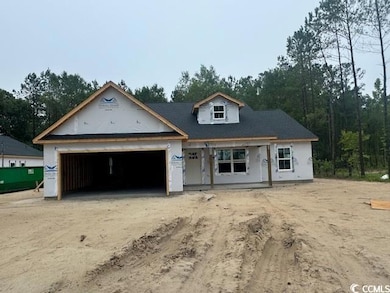 Property in mid-construction featuring driveway and an attached garage
