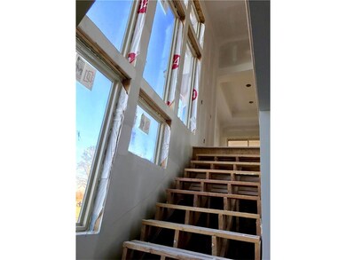 Dramatic Staircase to Lower Level.