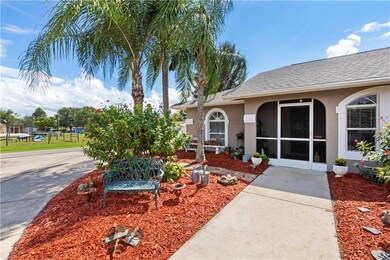 Front View with beautiful Landscaping with screene