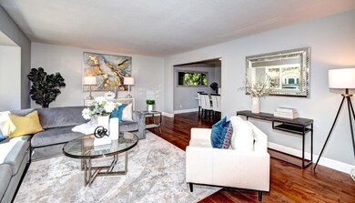 Spacious living room with bay window.