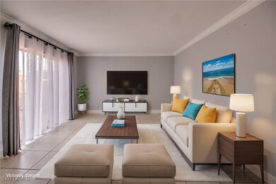Living area featuring light tile patterned floors,