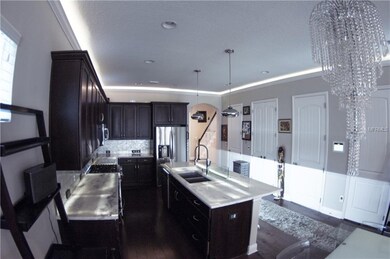 Kitchen with lighting over cabinets