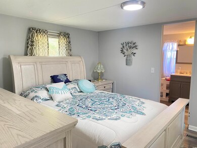 Bedroom with sink, dark hardwood / wood-style floo