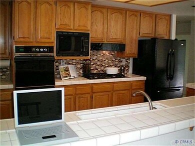 Beautifully appointed kitchen with glass and trave