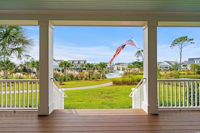 Deck with a water view and a yard