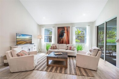 Living area featuring lofted ceiling and wood finished floors