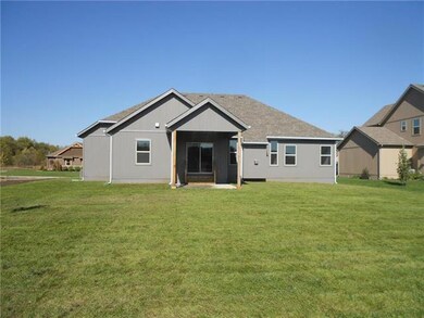 Back of Ranch style home. Cover patio.