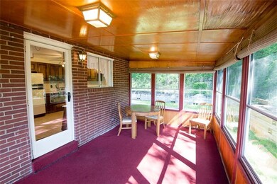 Access this spacious Enclosed Sunroom from the Kit