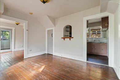 Unfurnished room featuring hardwood / wood-style 