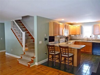 Kitchen view with stairs to 2nd...