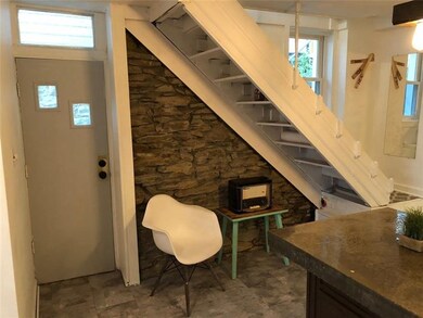 The side entrance into the kitchen provides easy a
