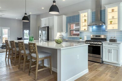 The kitchen is the center of the gathering space! 