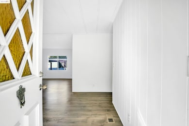 Hall featuring wood finished floors