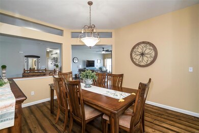 The wood plank flooring extends into the 12x12 Din