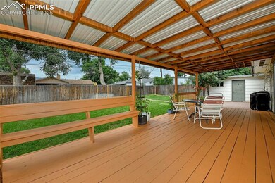Deck With View Of Fenced Backyard And Storage Shed