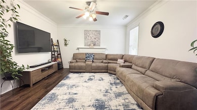 Living area with dark wood finished floors, a ceil