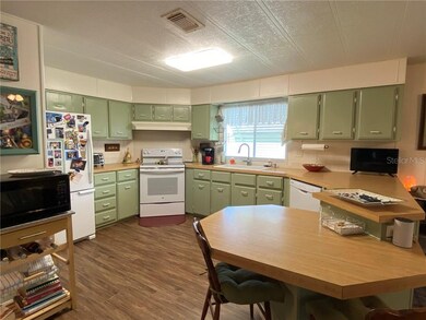 Large kitchen with table height seating for two.