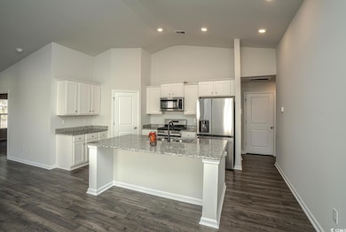 Kitchen with appliances with stainless steel finis
