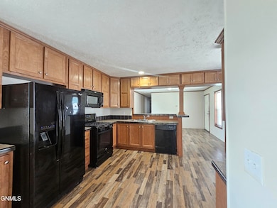 1023 28th St W, Williston, ND 58801 - photo 7