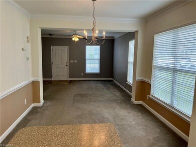 View from the kitchen, looking into the dining and living area.