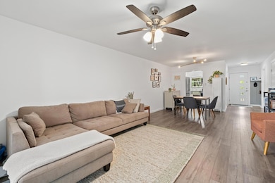 Living area with hardwood / wood-style floors and