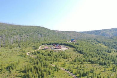 View of mountain backdrop featuring a forest