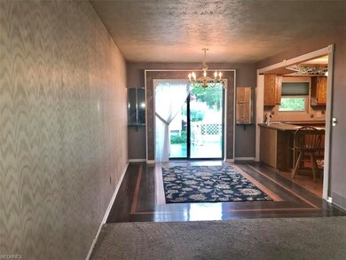 Dining room opens to living room and kitchen