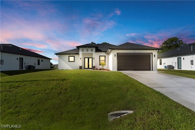 Prairie-style house featuring stucco siding, drive
