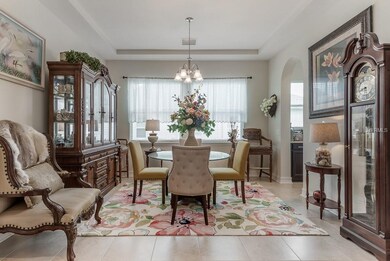 Formal dining room just off the foyer with tray ce
