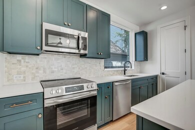 Kitchen featuring stainless steel appliances, a s