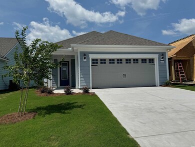 Ranch-style house featuring a garage and a front l