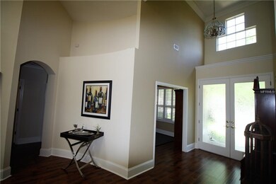Entrance Features Etched Glass Doors & Soaring Cei
