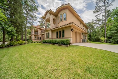 Two Garages - Located on each side of the home with a gated circle drive at entrance.