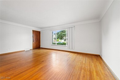 Living room with light hardwood / wood-style floors