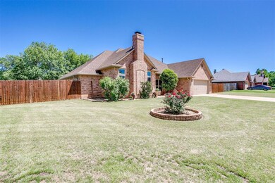 View of front of house with a garage and a front l