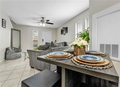 Tiled dining space with ceiling fan